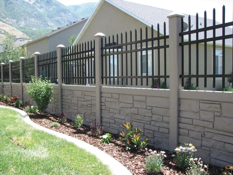Hybrid fence with stone-look composite panels and black aluminum pickets along a landscaped yard in Louisville, Kentucky