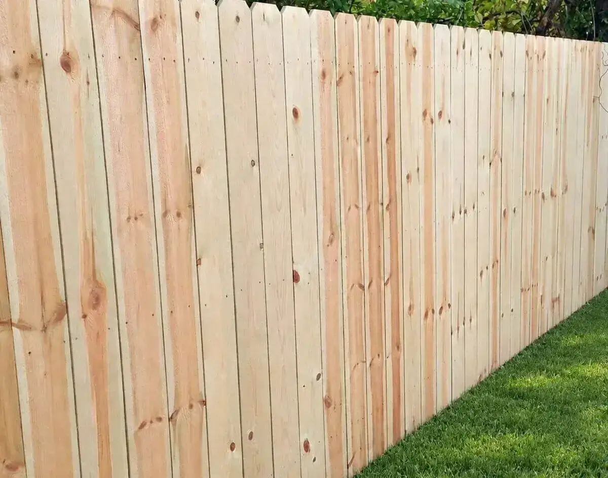 Six-foot wood privacy fence along a backyard property line in Louisville, Kentucky